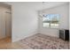 Bright dining room with modern chandelier, patterned rug, and ample natural light at 4759 Riverwalk Dr, St Cloud, FL 34771
