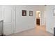 Neutral hallway that provides access to a bedroom with bathroom, creating a seamless flow within the home at 4759 Riverwalk Dr, St Cloud, FL 34771