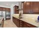 Modern kitchen with custom cabinets, granite counters, stainless steel appliances, and stylish backsplash at 4759 Riverwalk Dr, St Cloud, FL 34771