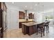 Well-appointed kitchen with granite island, stainless steel appliances, and bar seating at 4759 Riverwalk Dr, St Cloud, FL 34771