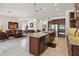 Bright, open kitchen with granite island, stainless appliances, and seamless flow into the living area at 4759 Riverwalk Dr, St Cloud, FL 34771