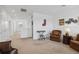 Spacious living room with a view of the hallway, carpet flooring, and plenty of seating at 4759 Riverwalk Dr, St Cloud, FL 34771