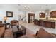 Open floor plan showcasing living room, staircase, and gourmet kitchen with stainless steel appliances at 4759 Riverwalk Dr, St Cloud, FL 34771
