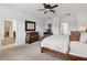 Spacious main bedroom with attached bath, computer desk, and well appointed furnishings at 4759 Riverwalk Dr, St Cloud, FL 34771