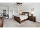 Bright main bedroom featuring a ceiling fan and a small desk area at 4759 Riverwalk Dr, St Cloud, FL 34771