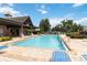 Inviting community pool with lounge chairs and a covered pavilion area for residents to enjoy on a sunny day at 4759 Riverwalk Dr, St Cloud, FL 34771