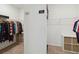 Spacious walk-in closet with shelving and hanging rods for organized storage, labeled ' ' and ' ' at 4759 Riverwalk Dr, St Cloud, FL 34771