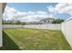 Spacious backyard with a well-maintained lawn and a white fence at 504 Key Haven Dr, Sanford, FL 32771