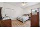 Bright bedroom with light wood floors, ceiling fan, and closet at 504 Key Haven Dr, Sanford, FL 32771