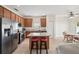 Open kitchen and dining area with stainless steel appliances and large island at 504 Key Haven Dr, Sanford, FL 32771