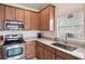 Well-lit kitchen features stainless steel appliances and light countertops at 504 Key Haven Dr, Sanford, FL 32771