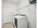 Laundry room with white appliances, shelving, and tile floor at 504 Key Haven Dr, Sanford, FL 32771