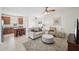 Inviting living room featuring tile floors and comfortable seating arrangement adjacent to kitchen at 504 Key Haven Dr, Sanford, FL 32771