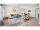 Open living room area featuring mixed flooring types, neutral tones and elegant decor at 504 Key Haven Dr, Sanford, FL 32771