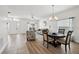 Cozy living and dining area featuring mixed flooring types and plenty of natural light at 504 Key Haven Dr, Sanford, FL 32771