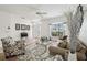Comfortable living room featuring a large window, stylish decor, and inviting seating area at 504 Key Haven Dr, Sanford, FL 32771