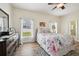 Comfortable main bedroom features a ceiling fan and two windows at 504 Key Haven Dr, Sanford, FL 32771
