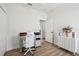 Office space with wood floors, closet, and built-in desk with white chair at 504 Key Haven Dr, Sanford, FL 32771