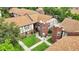 Aerial view showcasing meticulously landscaped grounds and charming architectural details of the residences at 5323 Hansel Ave # E14, Orlando, FL 32809