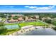 Expansive aerial view of the community, showcasing lush landscaping, water access, and recreational amenities at 5323 Hansel Ave # E14, Orlando, FL 32809