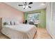 Bedroom boasting a large bed, work desk, and built-in closet at 5323 Hansel Ave # E14, Orlando, FL 32809