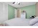 Spacious bedroom with neutral walls, built in closet and a ceiling fan at 5323 Hansel Ave # E14, Orlando, FL 32809