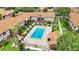 Stunning aerial shot of the community pool, complete with lounge areas and lush landscaping at 5323 Hansel Ave # E14, Orlando, FL 32809