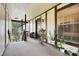 View of a building's exterior with a landing, and potted plants adding a touch of nature at 5323 Hansel Ave # E14, Orlando, FL 32809