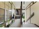 Inviting front porch with potted plants and natural light creating a warm welcome at 5323 Hansel Ave # E14, Orlando, FL 32809