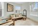 Relaxing sun room filled with light and comfortable wicker seating at 5323 Hansel Ave # E14, Orlando, FL 32809