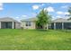Exterior of a single Gathering home with a large backyard at 5395 Sunshine Dr, Wildwood, FL 34785