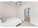 Comfortable bedroom with neutral carpet and a door leading to the rest of the home at 5395 Sunshine Dr, Wildwood, FL 34785