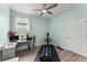 Office room featuring vinyl floors, a desk, and windows allowing lots of natural light at 5395 Sunshine Dr, Wildwood, FL 34785