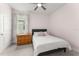Comfortable bedroom with neutral carpet and plenty of natural light from a window at 5395 Sunshine Dr, Wildwood, FL 34785
