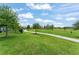 Enjoy this community park featuring lush green space, walking paths, and mature trees for recreational activities at 5395 Sunshine Dr, Wildwood, FL 34785