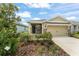 Well-manicured front yard with mature landscaping complements the exterior of this inviting single-Gathering home at 5395 Sunshine Dr, Wildwood, FL 34785
