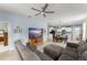 Spacious living room with open layout flowing into the kitchen and dining area, perfect for entertaining and everyday living at 5395 Sunshine Dr, Wildwood, FL 34785