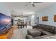 Open-concept living area featuring a kitchen and dining area with modern appliances and furniture for comfortable living at 5395 Sunshine Dr, Wildwood, FL 34785