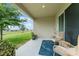 Relaxing covered patio with outdoor seating and serene views at 5395 Sunshine Dr, Wildwood, FL 34785
