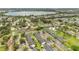 Aerial view of a residential community featuring manicured landscaping and a picturesque lake at 5662 Royal Pine Blvd # 24, Orlando, FL 32807