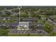 Aerial view of multi-Gathering home with parking, trees, and green spaces surrounding the building at 5662 Royal Pine Blvd # 24, Orlando, FL 32807