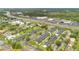 Birds eye view of the multi-Gathering home with parking, street access, tree coverage, and green space at 5662 Royal Pine Blvd # 24, Orlando, FL 32807