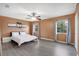 Spacious bedroom features a modern ceiling fan, and lots of natural light through the windows at 5662 Royal Pine Blvd # 24, Orlando, FL 32807