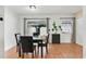 Bright dining room with a table set, sleek floors, and a minimalist design at 5662 Royal Pine Blvd # 24, Orlando, FL 32807