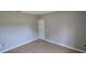 Empty bedroom with ceramic tile flooring, base trim, and neutral paint at 607 Escondido Ct, Kissimmee, FL 34758