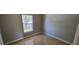 Cozy bedroom featuring neutral paint, tile flooring, and a sunlit window at 607 Escondido Ct, Kissimmee, FL 34758