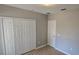 Bedroom featuring tile flooring, closet and a window at 607 Escondido Ct, Kissimmee, FL 34758