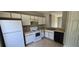 Bright kitchen with white cabinets, tile flooring, and modern appliances at 607 Escondido Ct, Kissimmee, FL 34758
