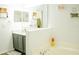 Bathroom with soaking tub and modern vanity at 608 Washington Way, Haines City, FL 33844