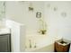Bathroom soaking tub with modern fixtures and neutral decor at 608 Washington Way, Haines City, FL 33844